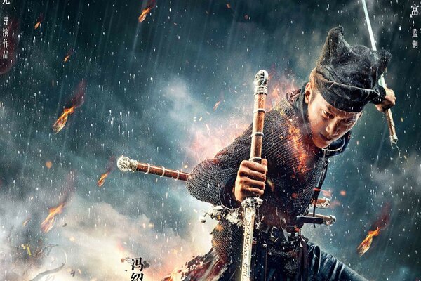 Hombre con dos espadas bajo la lluvia