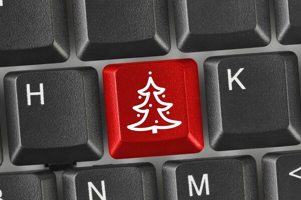 Botón rojo con imagen de espiga en el teclado negro