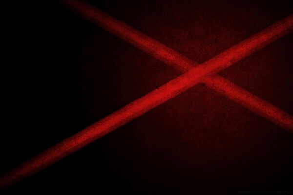 Sobre un fondo oscuro, las líneas rojas se cortan