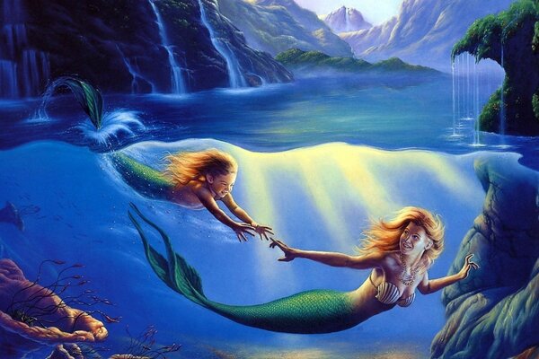 Sirenas jugando en el océano