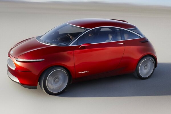 Concept Car rojo sobre arena gris