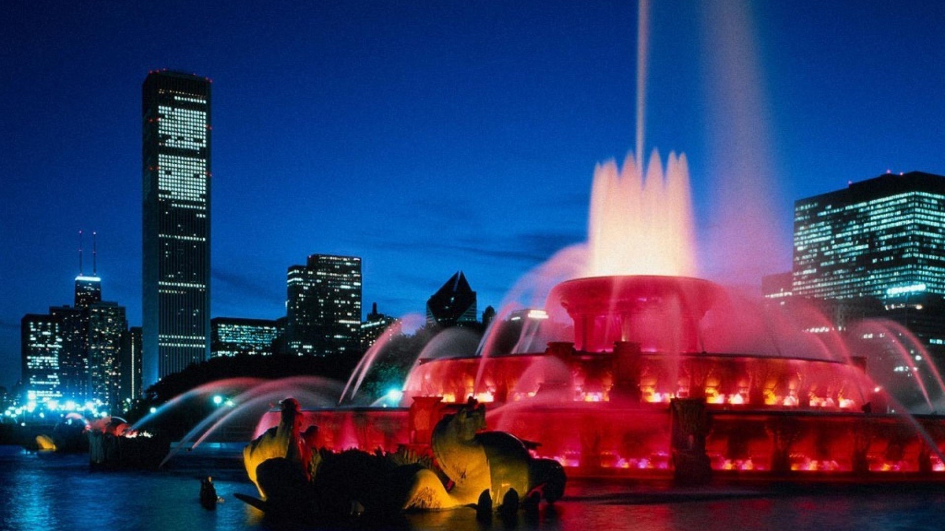 ciudad centro de la ciudad rascacielos ciudad noche crepúsculo viajes skyline arquitectura casa urbano luz calle puesta de sol puente agua reflexión iluminado río cielo