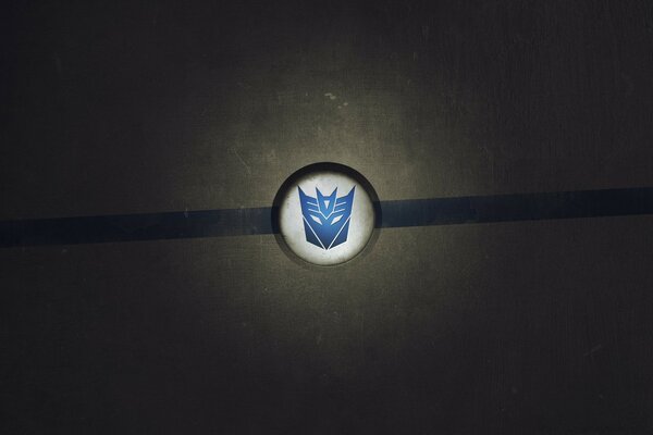 Signo de Transformers azul sobre fondo blanco